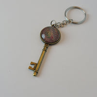 Red, Green, and Tan Key-Shaped Key Chain
