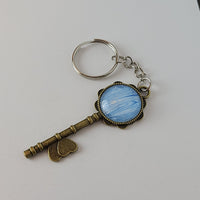 Blue and White Key-Shaped Key Chain