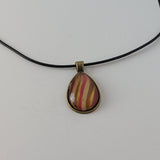 Red, Tan, and Gold Teardrop-Shaped Pendant