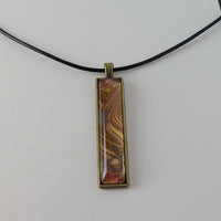 Red, Tan, and Gold Rectangular Pendant